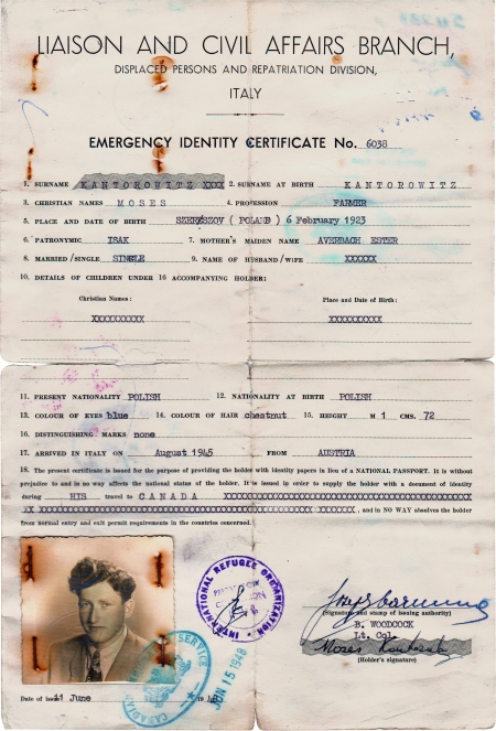 Copy of an aged yellow identity document. It contains typed text with handwritten signatures, stamps, and a black-and-white identity photograph in the bottom-left corner of a young man.